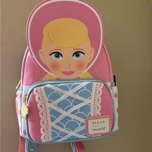Loungefly Pink and Blue Pixar Character Backpack